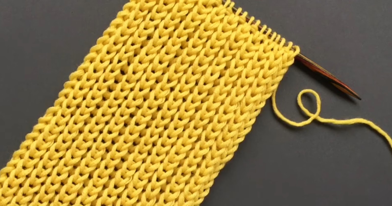 yellow yarn and knitting needle