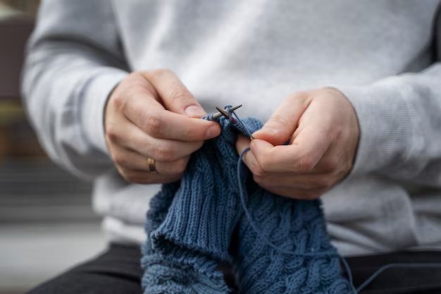 Hands knitting, close-up view