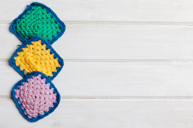 Three knitted elements on a white background